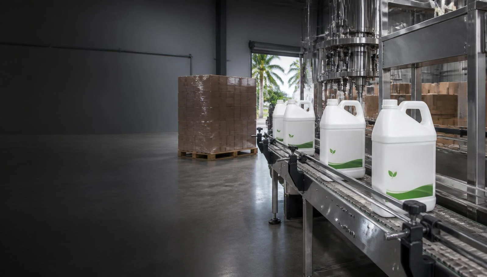 Standard 2.5-gallon private-label jugs on a liquid packaging line